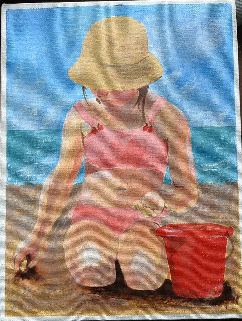 lady sitting on the beach