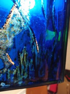 Blue stained glass piece